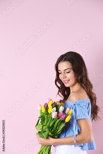 Beautiful woman holding bou...