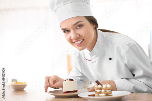 Female chef preparing tasty...