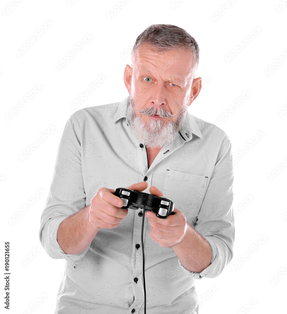 Emotional senior man playing video game on white background Emotional senior man playing video game on white background