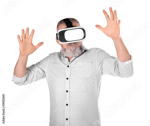 Senior man with virtual reality headset on white background