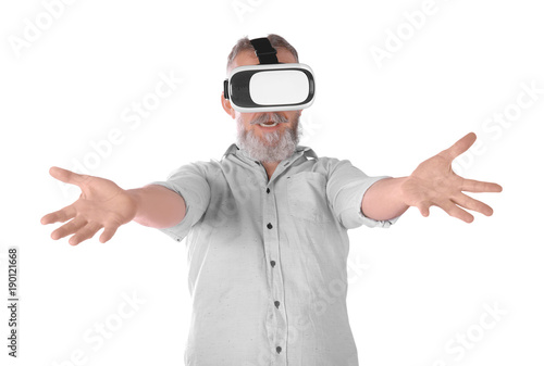 Senior man with virtual reality headset on white background