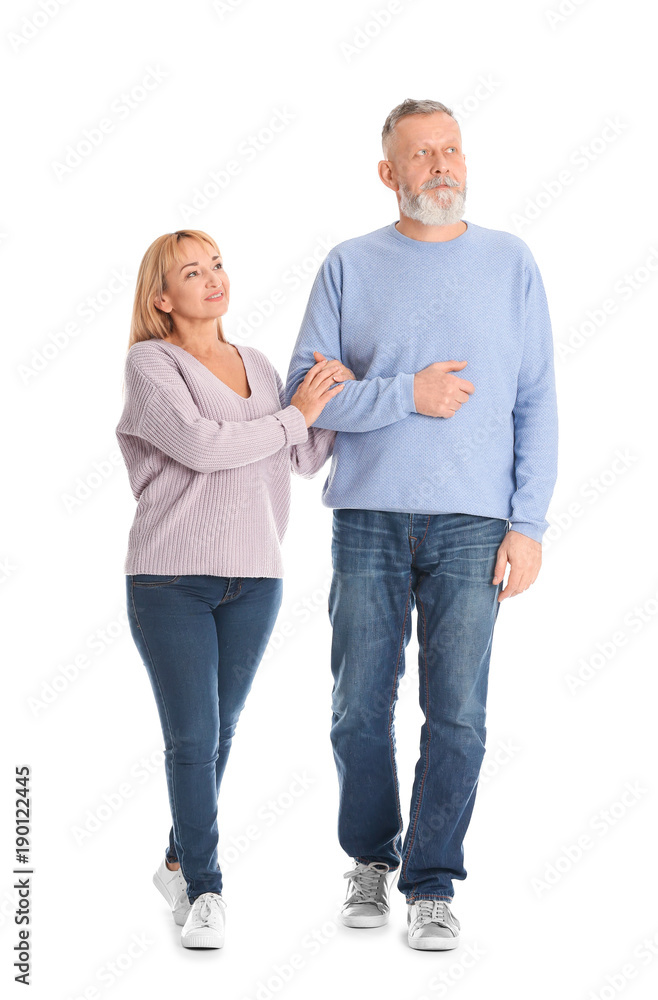 Mature couple in casual clothes walking on white background Mature couple in casual clothes walking on white background
