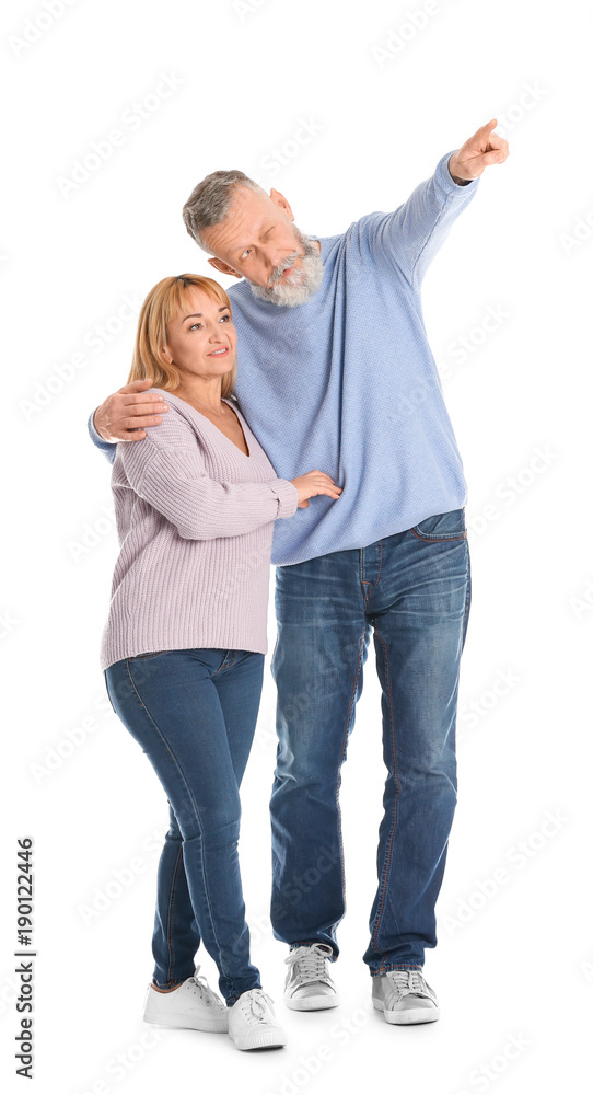 Mature couple in casual clothes walking on white background Mature couple in casual clothes walking on white background