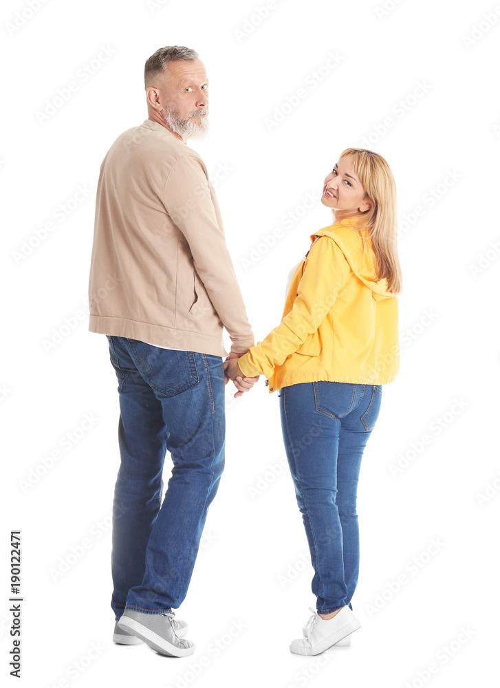 Mature couple in casual clothes walking on white background Mature couple in casual clothes walking on white background