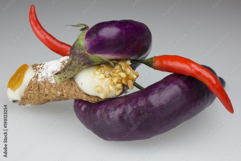 the sicilian cannolo in the aubergine spire, with tomato pepper Stock Photo  | Adobe Stock