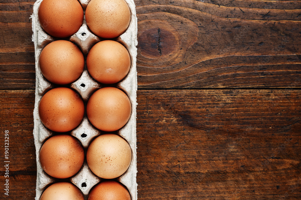 red chicken eggs on a wooden background red chicken eggs on a wooden background