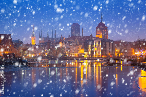 Old town of Gdansk on a cold winter night with falling snow, Poland
