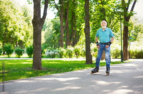 Senior man roller skating outdoors