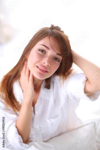 Portrait of beautiful young woman face. Isolated on white background.