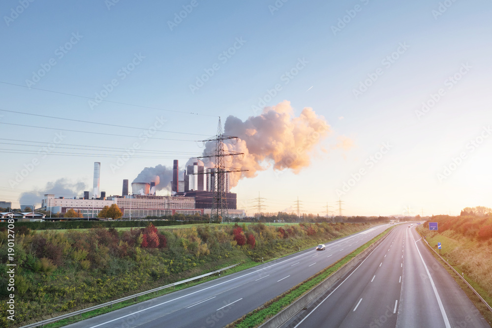 Empty Highway and coal power plant at sunrise. Germany, Weisweiler Empty Highway and coal power plant at sunrise. Germany, Weisweiler