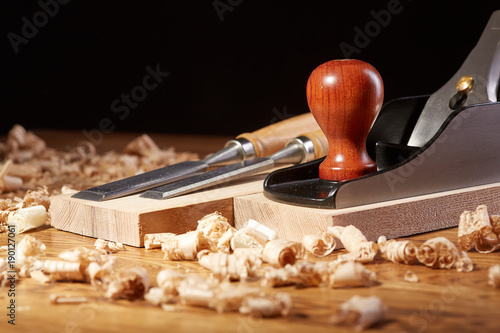 DIY concept. Woodworking and crafts tools. Carpentry hand tools. Planers, chisels, measuring tools. Wooden background. photo