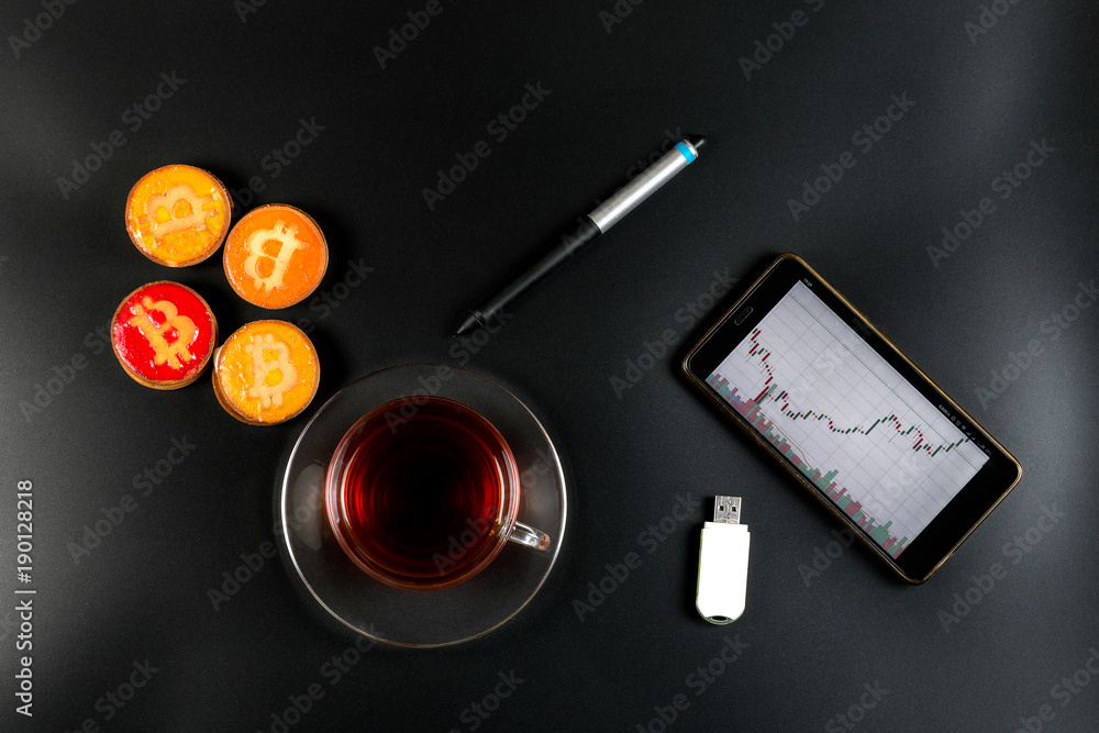 cookies bitcoin and tea on the trader's desktop cookies bitcoin and tea on the trader's desktop