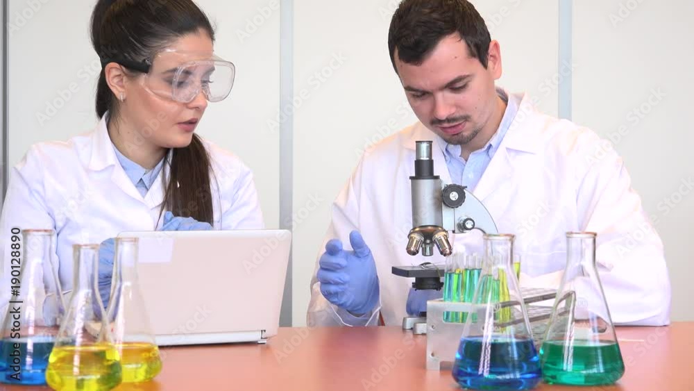 Biologist researcher group study microscope plant sample agriculture development