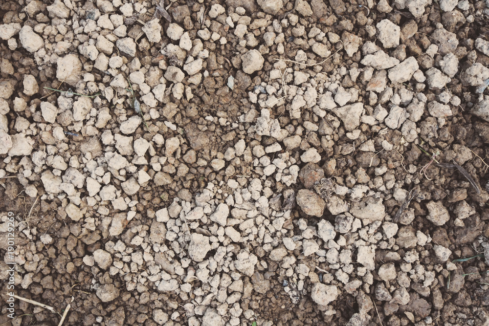Top view of gravel soil and soil ground, brown of small soil and dry soil, The soil that prepare for cultivation. Top view of gravel soil and soil ground, brown of small soil and dry soil, The soil that prepare for cultivation.