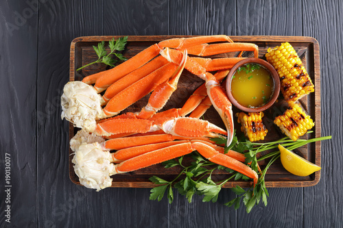 close-up of Crab legs and corn cobs photo