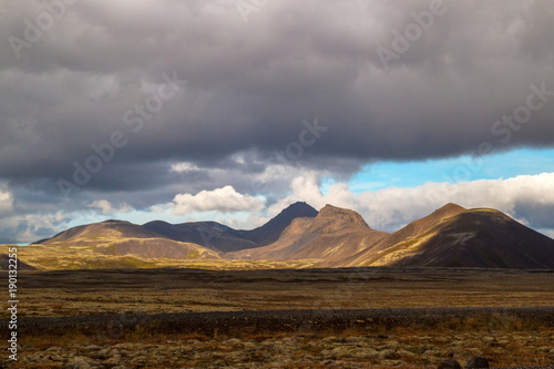 Dramatic light landscape with mountains view close to Reykjavik, road trip in Iceland