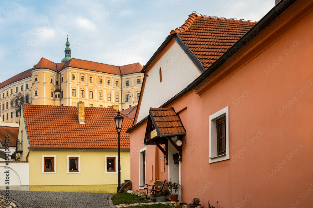 Street and houses of historic Czech town Mikulov with castle Street and houses of historic Czech town Mikulov with castle