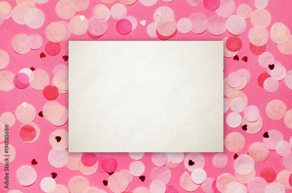 Heart shape made of pink glitter with copy space paper card note. Flat lay. Love concept.