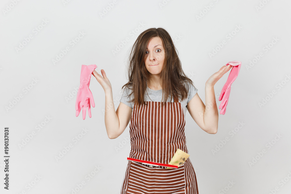 Young fun crazy dizzy loony wild screaming housewife tousled hair in striped apron squeegee cleaning rag in pocket isolated on white background. Mad woman and pink gloves. Copy space for advertisement Young fun crazy dizzy loony wild screaming housewife tousled hair in striped apron squeegee cleaning rag in pocket isolated on white background. Mad woman and pink gloves. Copy space for advertisement