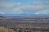 taiga and snow covered peaks of Bureya ridge in early spring Chegdomyn, Khabarovsky Krai, Russia