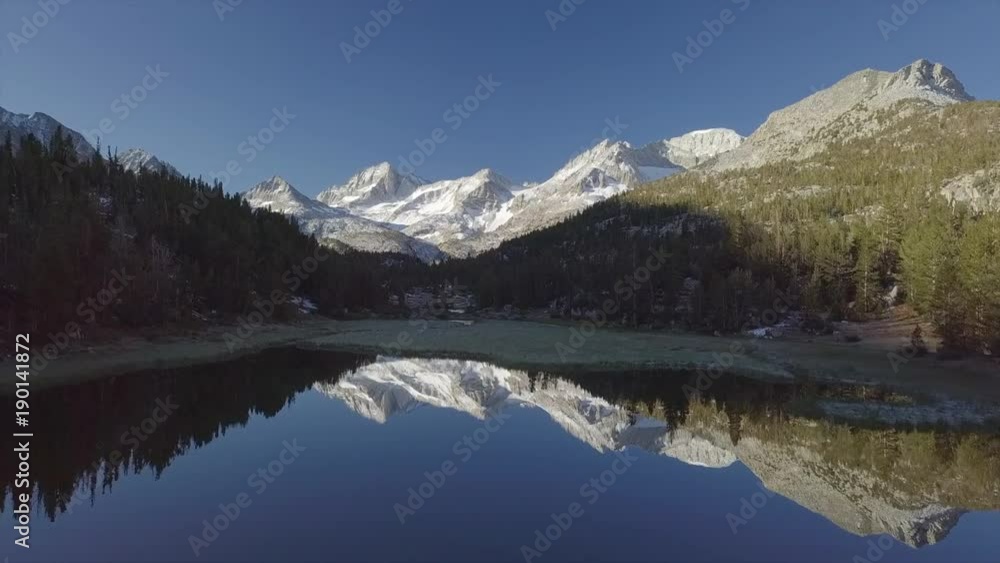 Aerial Snow Mountain Valley with Mirror Lake reflection - Inyo National Forest, Little Lakes Valley Trail (Gem Lakes), Bishop, California Aerial Snow Mountain Valley with Mirror Lake reflection - Inyo National Forest, Little Lakes Valley Trail (Gem Lakes), Bishop, California