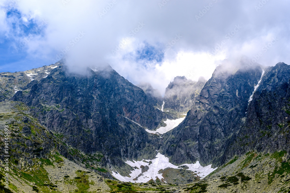 Obraz premium High Tatra mountains covered with clouds Sunny day, Lomnicky Stit