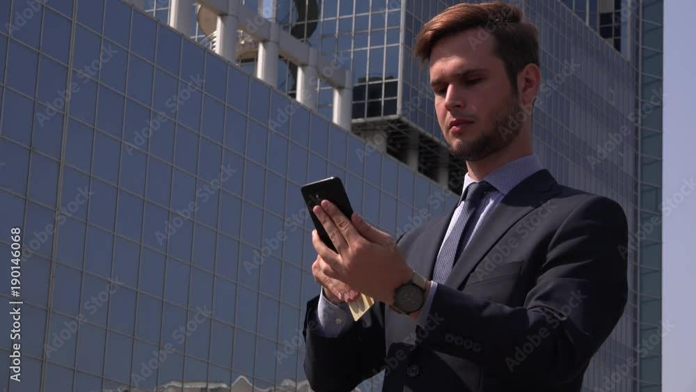 Elegance intelligent business man in the city online shopping scenery smartphone Elegance intelligent business man in the city online shopping scenery smartphone