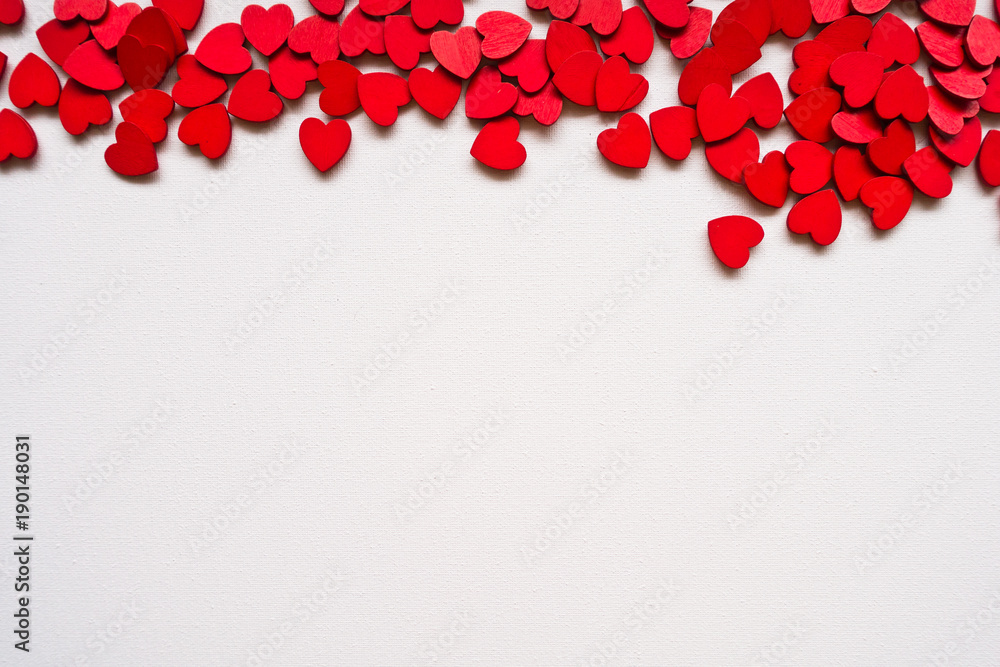 Valentines Day background with red hearts on white surface. Romantic seamless pattern for holiday, flat laz, top view Valentines Day background with red hearts on white surface. Romantic seamless pattern for holiday, flat laz, top view