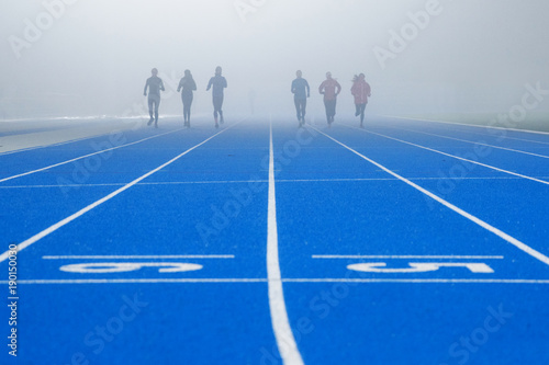 Athlete on blue tartan track