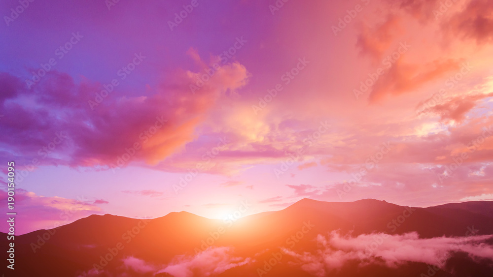 Twilight sky in purple over the mountain.