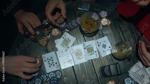Poker player throwing cards and win the game