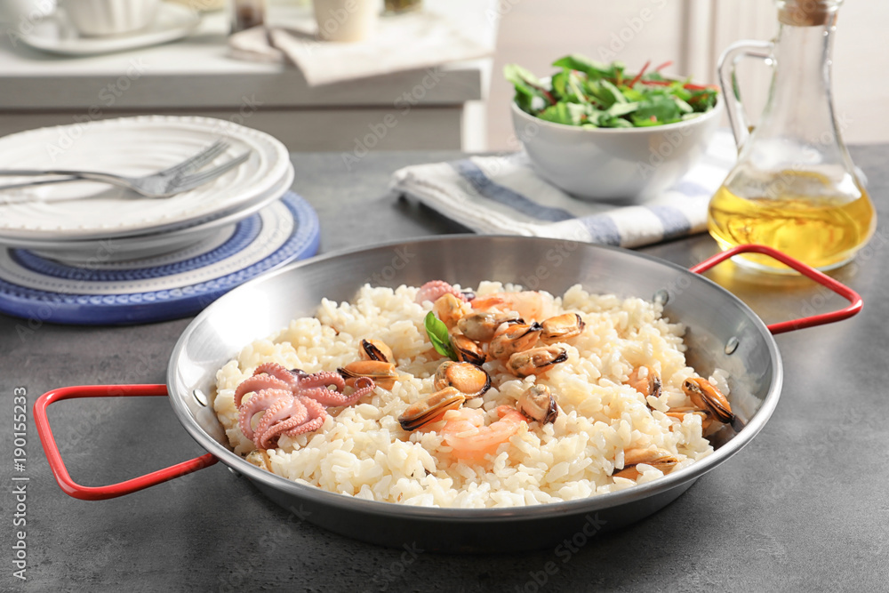 Dish with delicious seafood risotto on table Dish with delicious seafood risotto on table