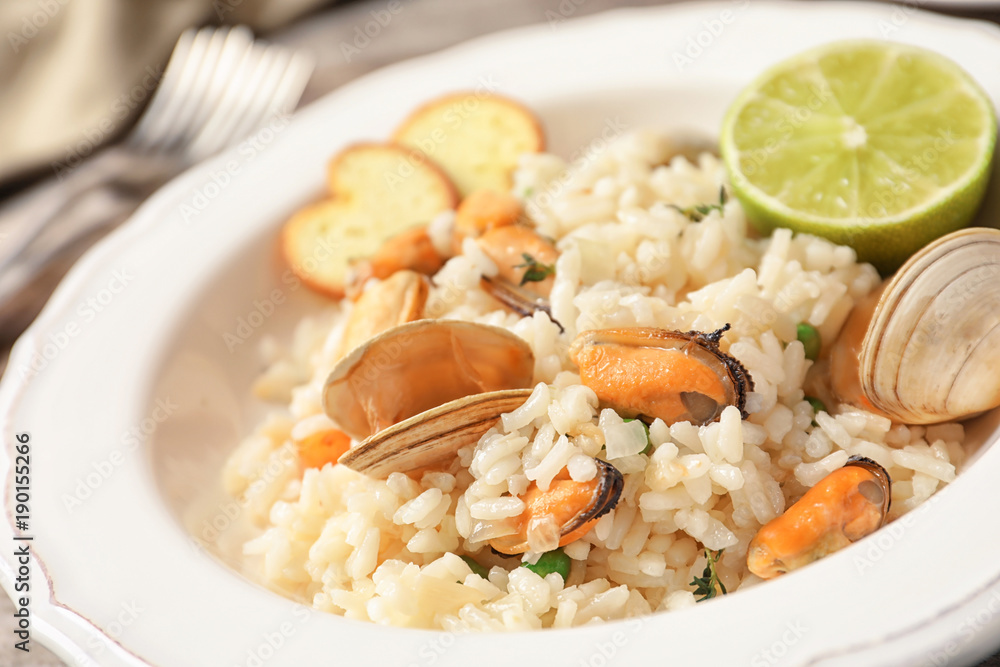 Plate with delicious seafood risotto, closeup Plate with delicious seafood risotto, closeup