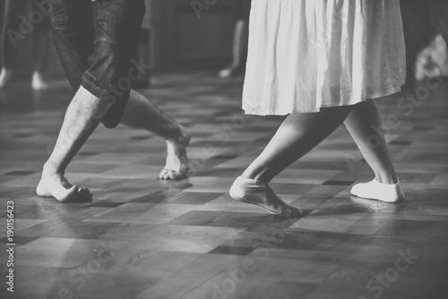 Feet of two dancers. Black and white vintage style photography