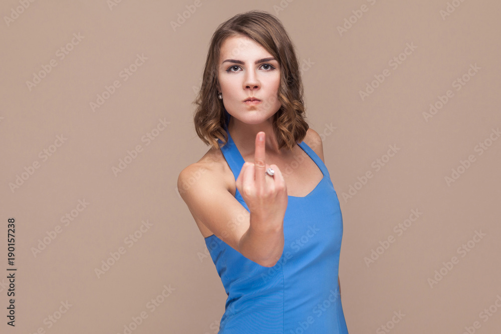 Fuck off! Bad girl showing fuck sign at camera Stock Photo | Adobe Stock