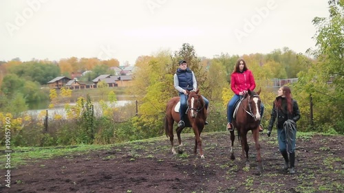 Wallpaper Mural young couple in a Russian village with horses, riding Torontodigital.ca