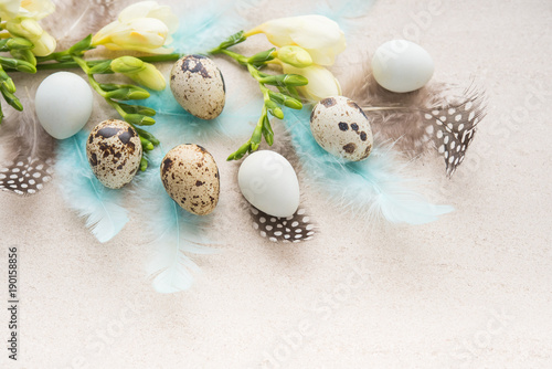 Easter eggs with flowers and feathers, greeting card