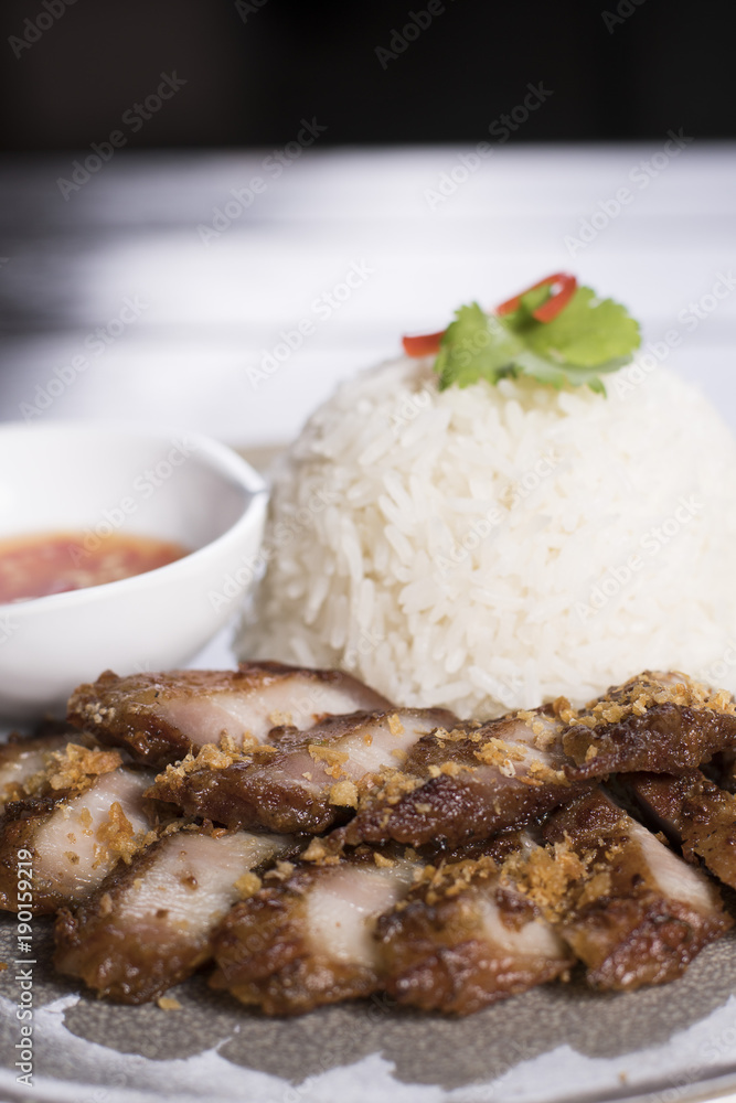 Deep Fried Pork Belly over Rice  served with spicy sauce