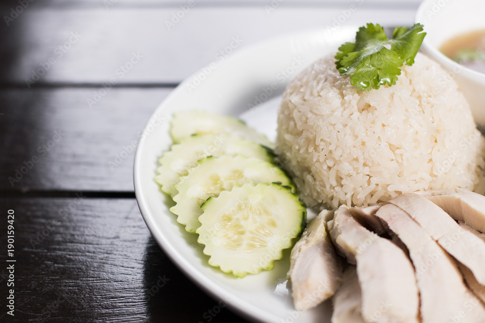 Steamed chicken served over ginger jasmine rice with a side of chicken broth and homemade fermented soy bean sauce Steamed chicken served over ginger jasmine rice with a side of chicken broth and homemade fermented soy bean sauce