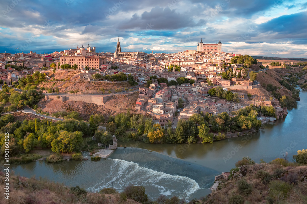 Aerial view of Old city of Toledo and river Tajo in the overcast day, Castilla La Mancha, Spain - obrazy, fototapety, plakaty 