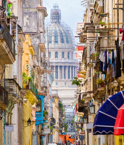 Scene in Old Havana with the Capitol building on the background © kmiragaya