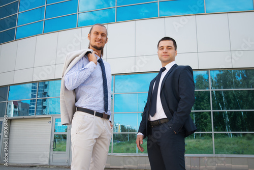 2719143 a businessman in a suit around the office