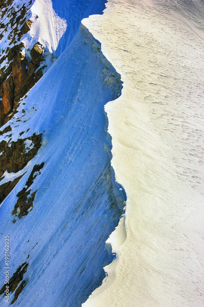 Icy mountain ridge. Closeup. Sunny day.