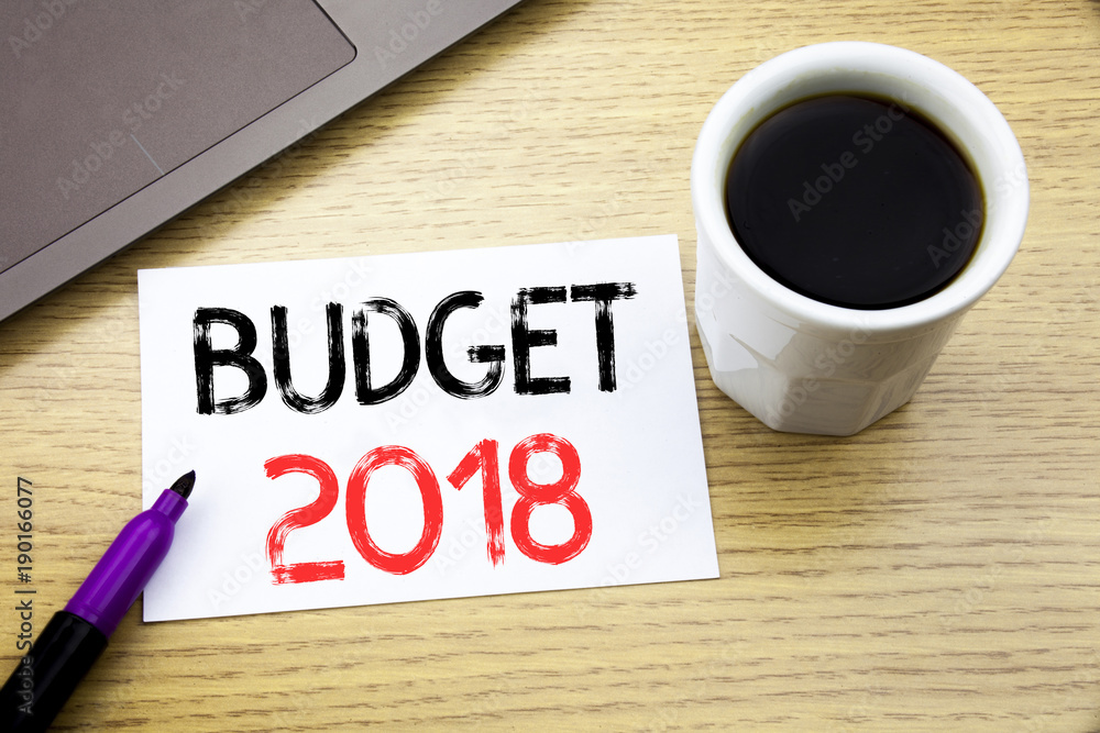 Handwriting Announcement text showing Budget 2018. Business concept for Household budgeting accounting planning written on notebook book on the wooden background in the Office with laptop coffee Handwriting Announcement text showing Budget 2018. Business concept for Household budgeting accounting planning written on notebook book on the wooden background in the Office with laptop coffee