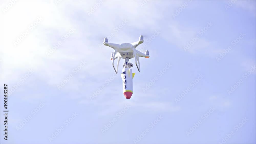 Terrorist drone high in sky with swinging bomb underneath 4K Terrorist drone high in sky with swinging bomb underneath 4K