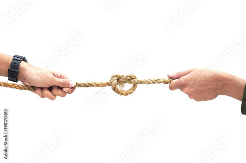 Tug War concept.Two Men pulling the rope with knot in opposite directions.