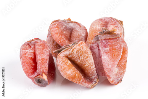 Dried persimmons on white background.
