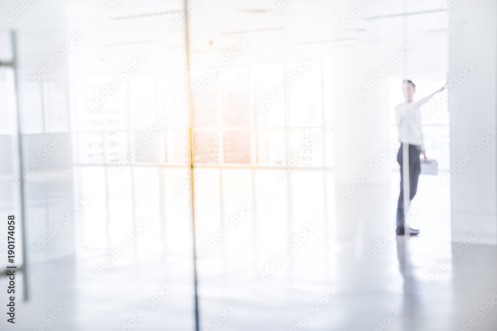 businessman pointing in the new modern office. businessman pointing in the new modern office.