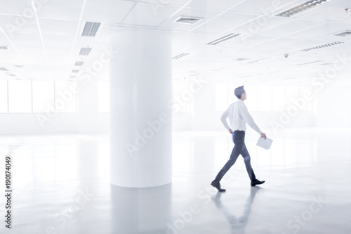 businessman walking in the new modern office.