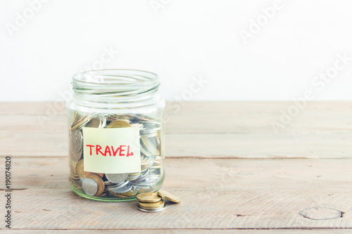 Coins in jar with Travel label